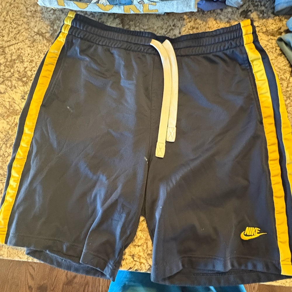Nike Men's Athletic Shorts in Black with Yellow Stripes